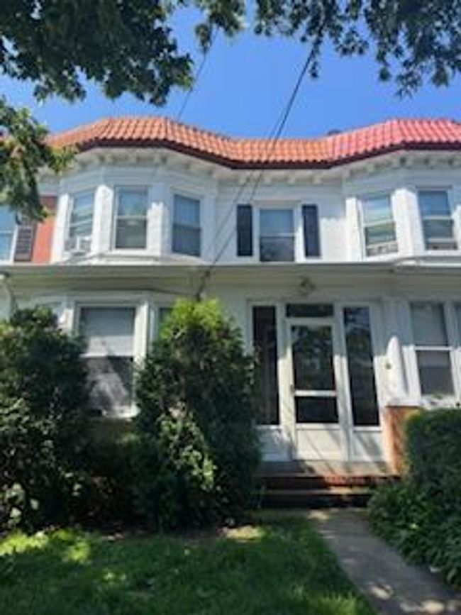 View of front facade featuring a tiled roof and entry steps | Image 7