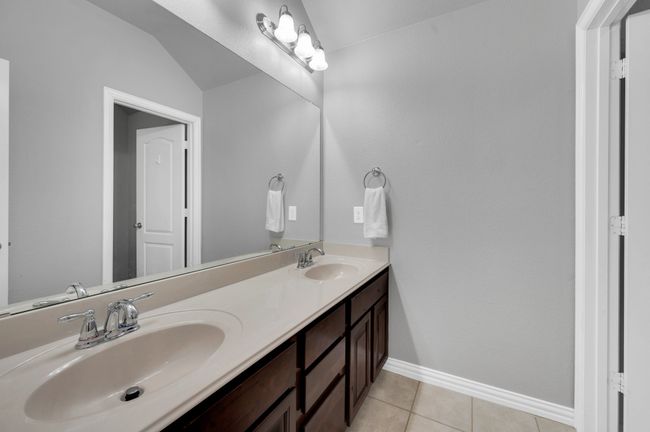 Second story full bath featuring double vanity. | Image 25