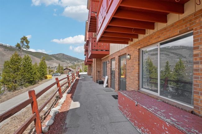 View of side of property featuring brick siding and a mountain view | Image 25