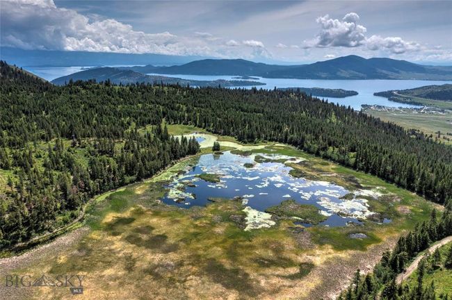 Drone / aerial view featuring a water and mountain view | Image 11