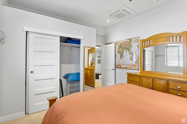 Bedroom featuring light carpet, a closet, and visible vents | Image 21