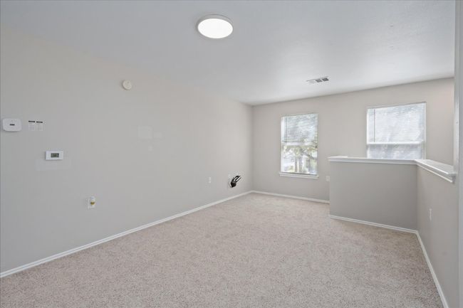 Unfurnished room featuring baseboards, visible vents, and carpet floors | Image 23