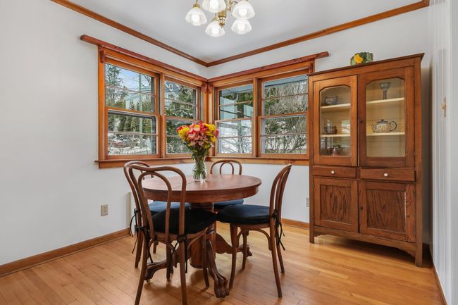 Dining space with lots of sunlight, windows and hardwood floor | Image 7