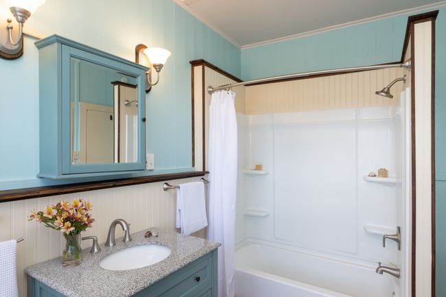 Newer bathroom with tub and shower, and free standing vanity. | Image 8
