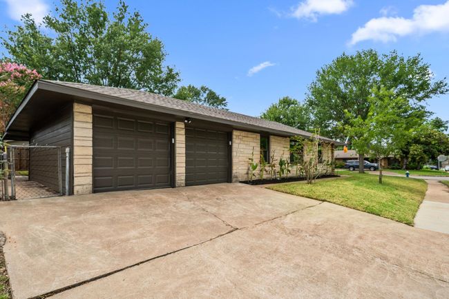 Corner lot offers extra off-street parking with a 2-car garage and two double-wide driveways | Image 26
