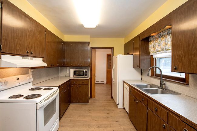 Galley kitchen overlooks large backyard! | Image 7