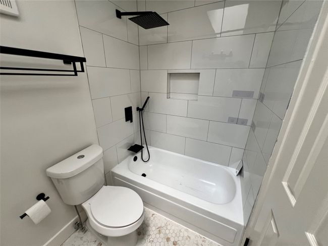 Bathroom with toilet and baseboards | Image 24