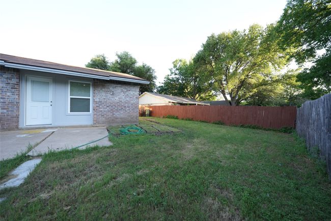 View of yard featuring a patio and a fenced backyard | Image 18