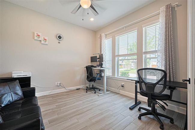 The dedicated office/study offers a quiet workspace with large windows that flood the room with natural light | Image 17