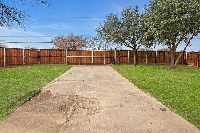 View of fenced backyard | Image 4