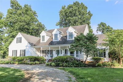 Cape cod home with a porch and a front lawn | Image 3