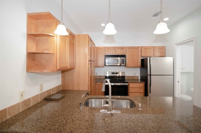 The Kitchen Features New Stove (7/25), New Wine Fridge (7/25), and newer Dishwasher Microwave, and Fridge. | Image 17