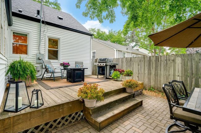 Room for seating, a table, and a grill | Image 30