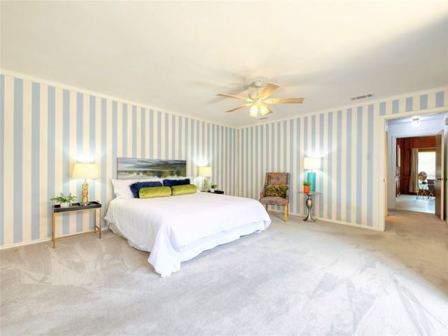 Carpeted bedroom featuring a ceiling fan and baseboards | Image 17