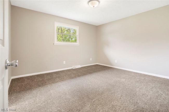 Bedroom featuring dark carpet | Image 16