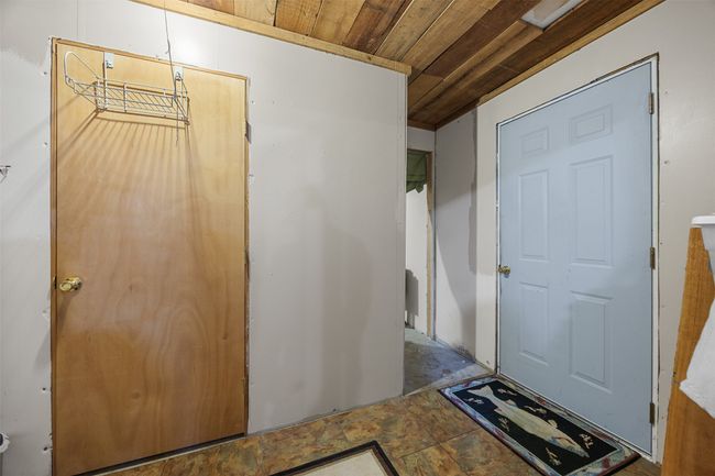 Foyer entrance from garage into utility room. Central heat/air is in this room | Image 18