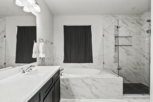 Oversized shower with frameless glass enclosure. | Image 17