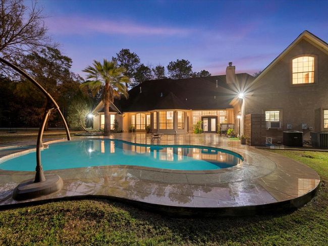 Evening magic. The resort-style pool glows under the Texas sky, creating the perfect spot to unwind after a long day. | Image 37