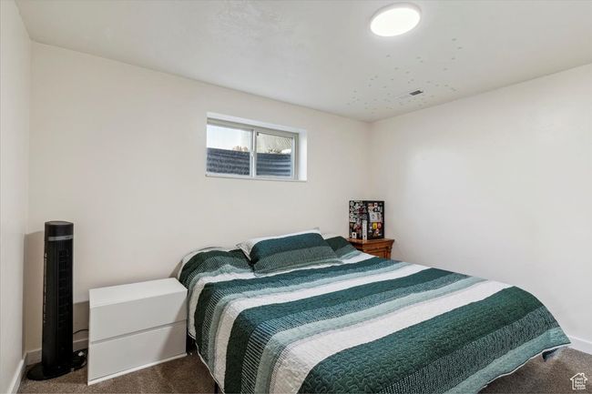 Bedroom with dark colored carpet | Image 23
