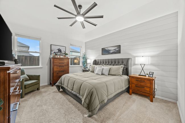 Bedroom featuring carpet, a ceiling fan, and baseboards | Image 16