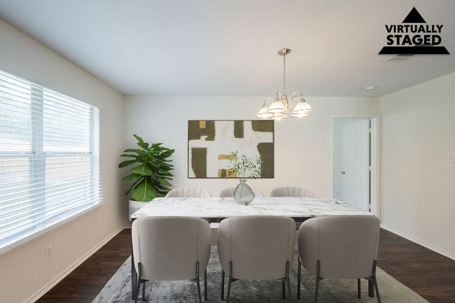 Dining room featuring a chandelier, dark wood finished floors, and baseboards | Image 12