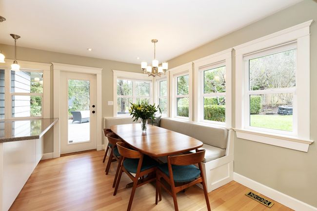 Dining area featuring visible vents, baseboards, light wood-style floors, and an inviting chandelier | Image 5
