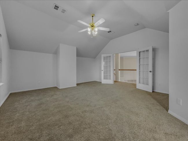 Additional living space with french doors, lofted ceiling, carpet, and a ceiling fan | Image 19