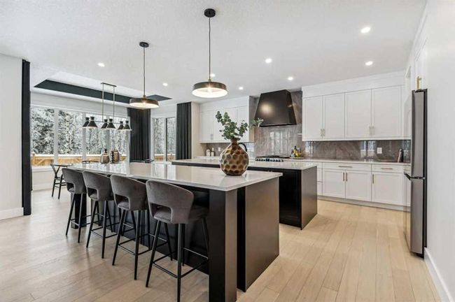66 Aspen Summit Close Sw, Home with 6 bedrooms, 4 bathrooms and 6 parking in Calgary AB | Image 4