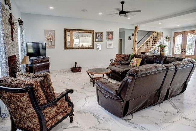 Large living room. Stairs to 2nd floor shown in the background | Image 11