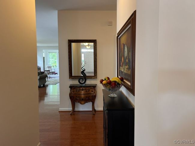 Hallway featuring dark hardwood / wood-style floors | Image 16
