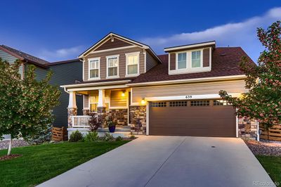 The curb appeal of this home is fantastic. Beautiful landscaping, inviting entry and warm colors. | Image 2