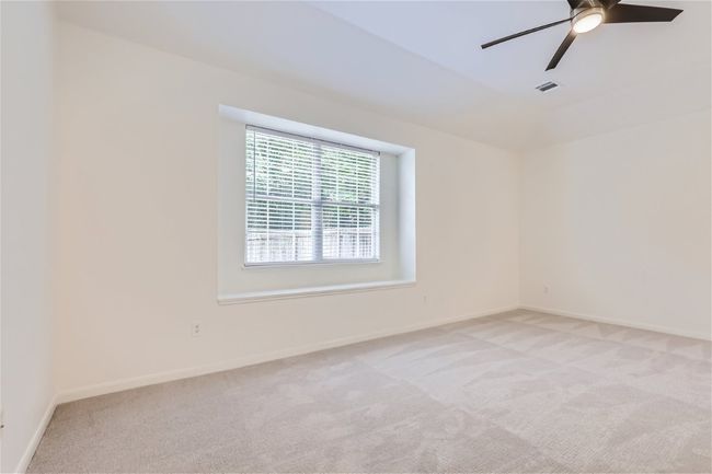 Spare room with light carpet, ceiling fan, and baseboards | Image 17