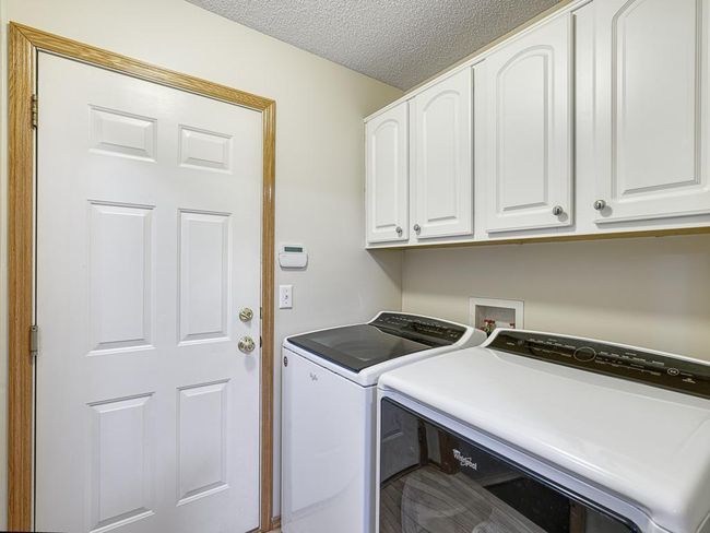 The laundry is conveniently located just off the kitchen and as you enter through the 2 car garage. | Image 19