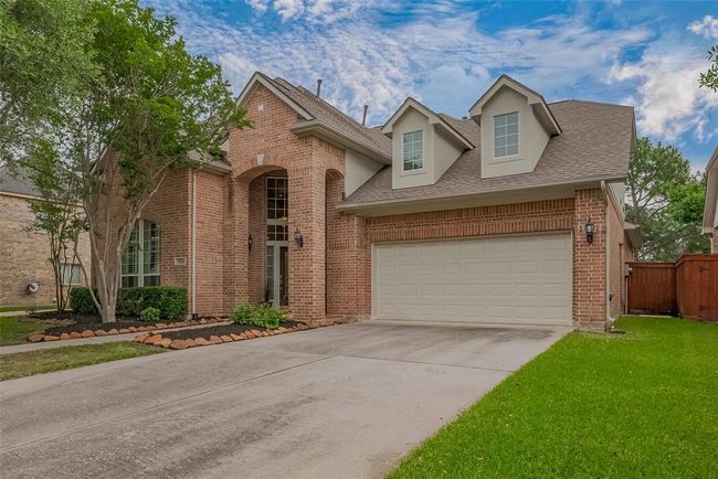 There is a 2 car attached garage with an auto garage door opener. | Image 39