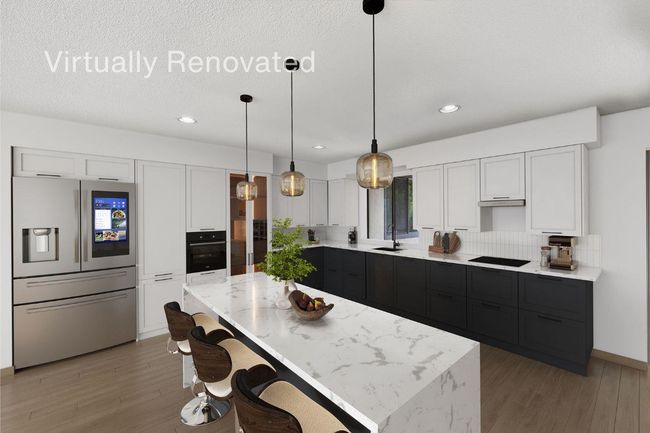 Kitchen with light stone counters, a kitchen island, decorative light fixtures, light wood finished floors, and black appliances | Image 19