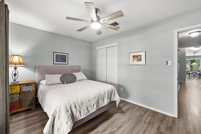 Bedroom with LVP floors, and ceiling fan | Image 20