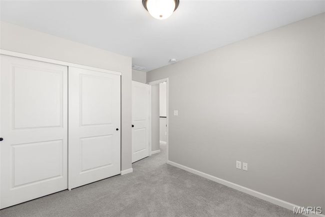 Unfurnished bedroom featuring baseboards, carpet floors, and a closet | Image 17