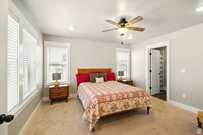 Bedroom with carpet, multiple windows, ceiling fan, and recessed lighting | Image 9