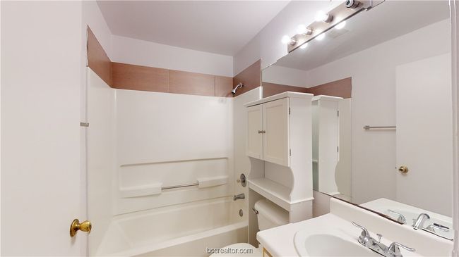Full bathroom featuring shower / bath combination, toilet, and vanity | Image 13