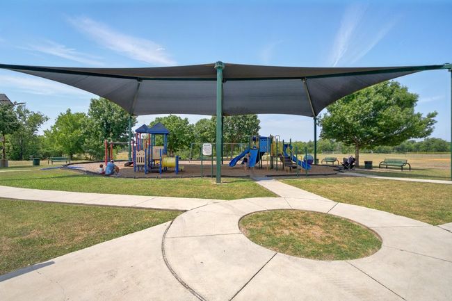 Communal playground featuring a yard | Image 24
