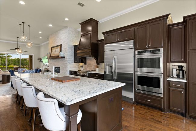 Kitchen with a view to the beautiful backyard. | Image 6