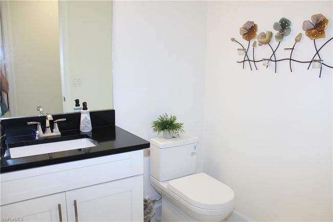 Half Bathroom featuring vanity and toilet | Image 22