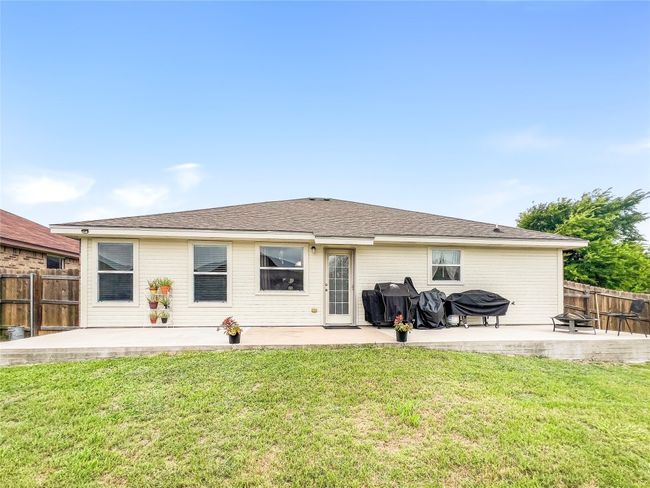 Rear view of house featuring a patio area | Image 19