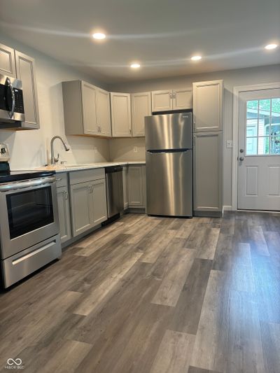 View from Living room looking into Kitchen with decorative accents | Image 3