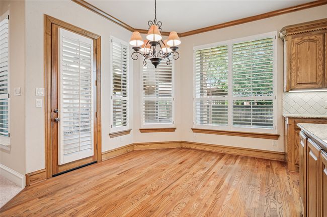Breakfast nook with hardwood flooring and plantation shutters | Image 17