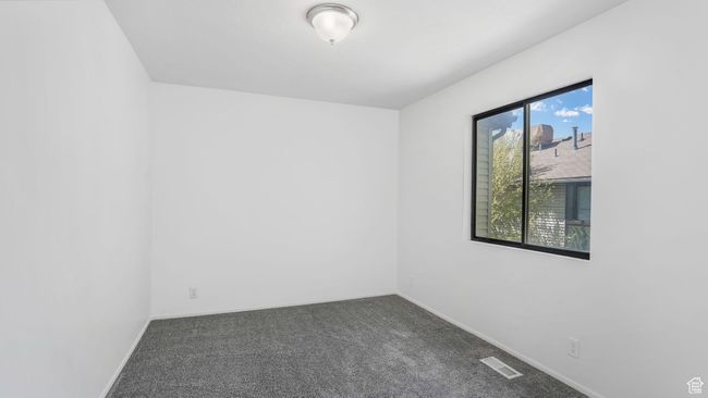 Carpeted upstairs bedroom. | Image 12