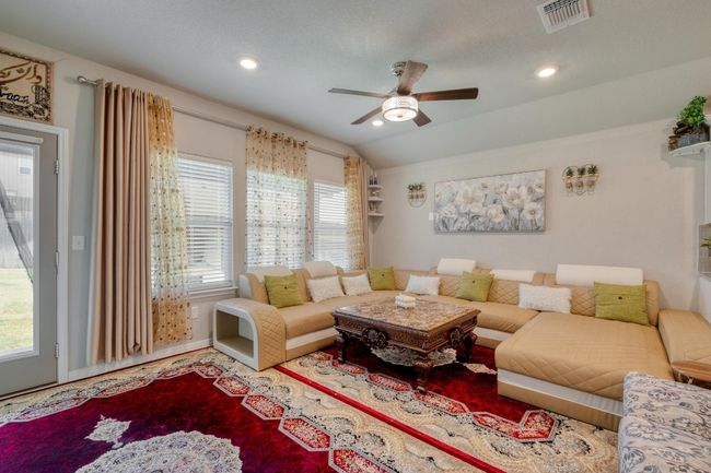 Living room featuring ceiling fan, baseboards, and recessed lighting | Image 5