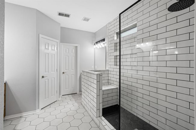 Bathroom with a walk in shower and tile patterned floors | Image 22