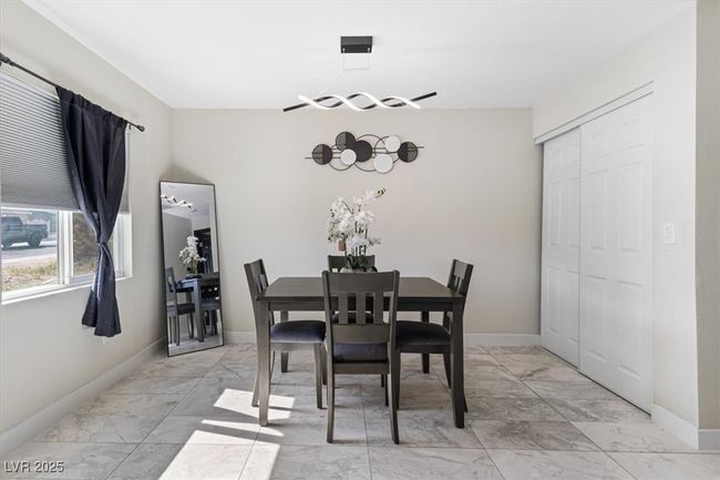 Dining area featuring marble finish floor and baseboards | Image 14