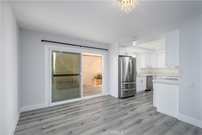 Dining room, open to living room and kitchen. | Image 7
